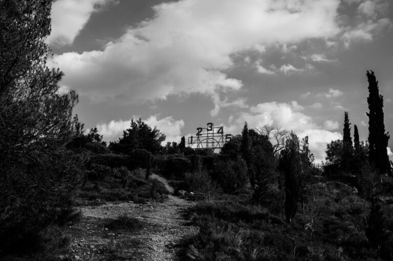 An old reservoir up in the hills above the city of Athens photographed in black and white.