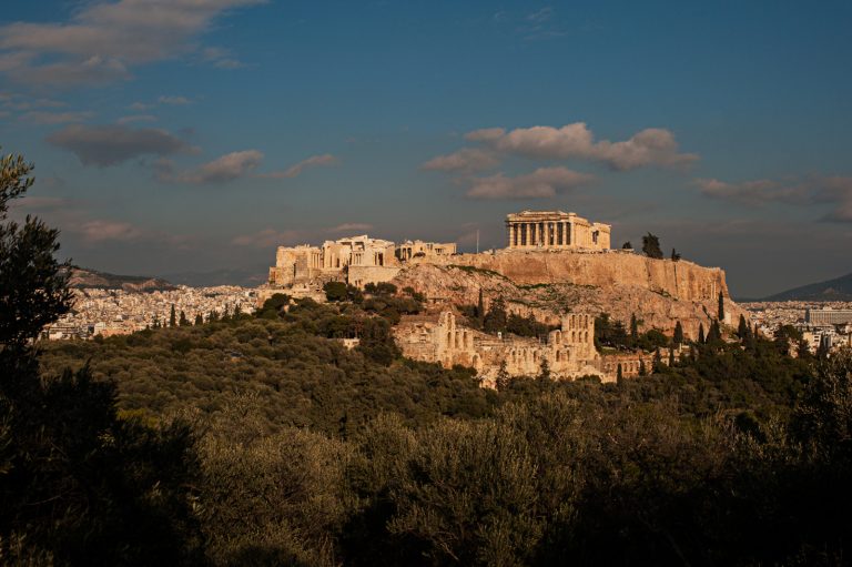 A photograph of the Acropolis in Athens Greece with a cloudy winter sky in the background