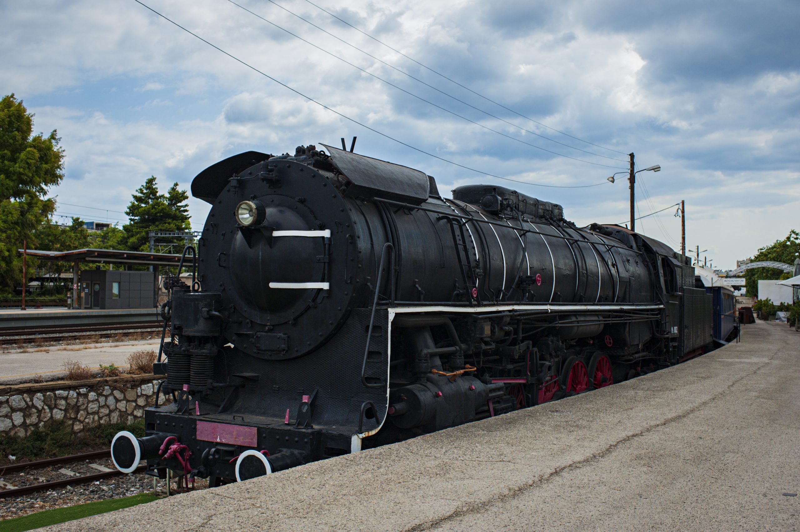 An old engine that was once part of the stock of the Orient Express taken against a cloudy sky
