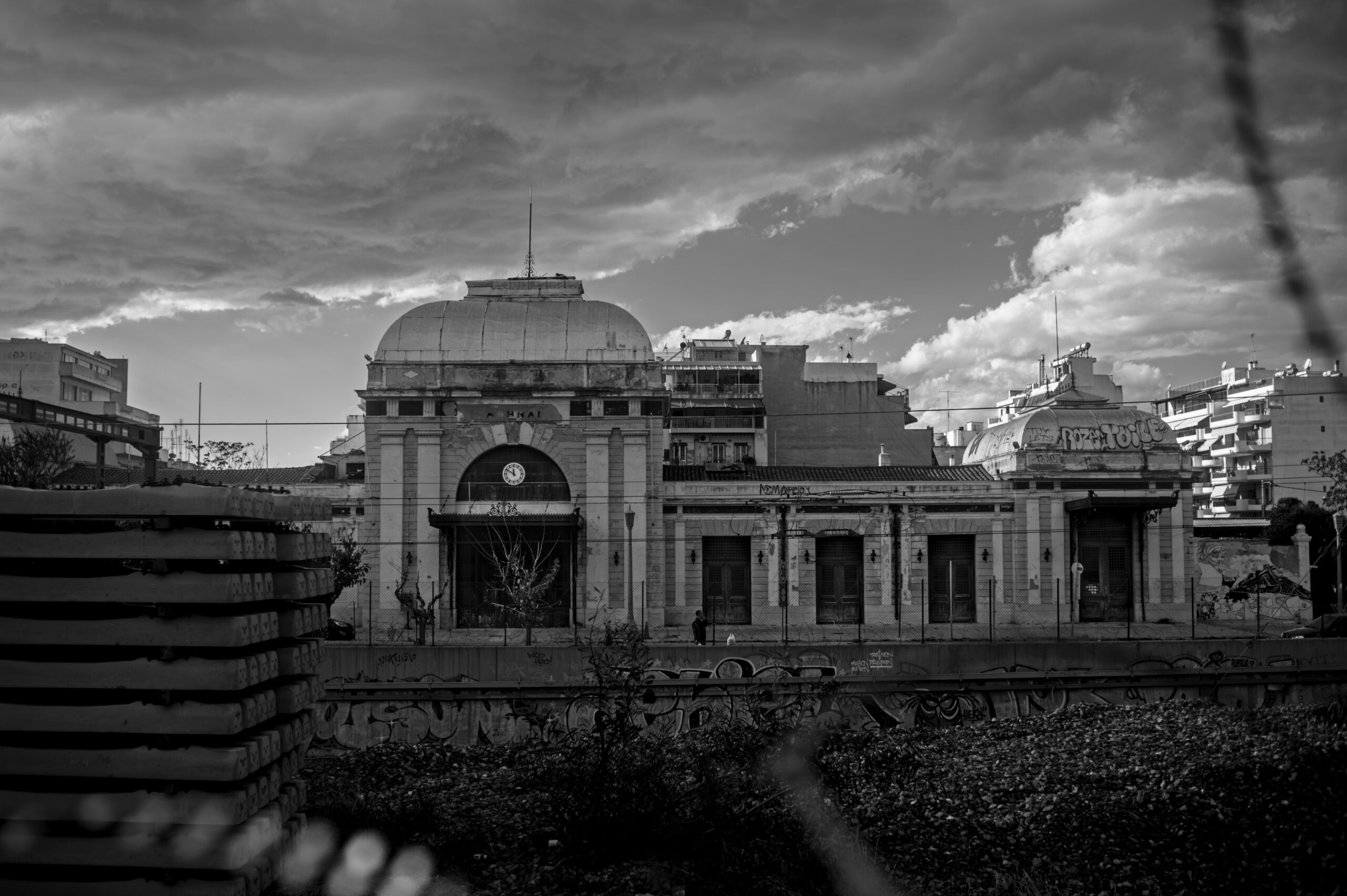 The grand abandoned railway station in Athens taken in black and white