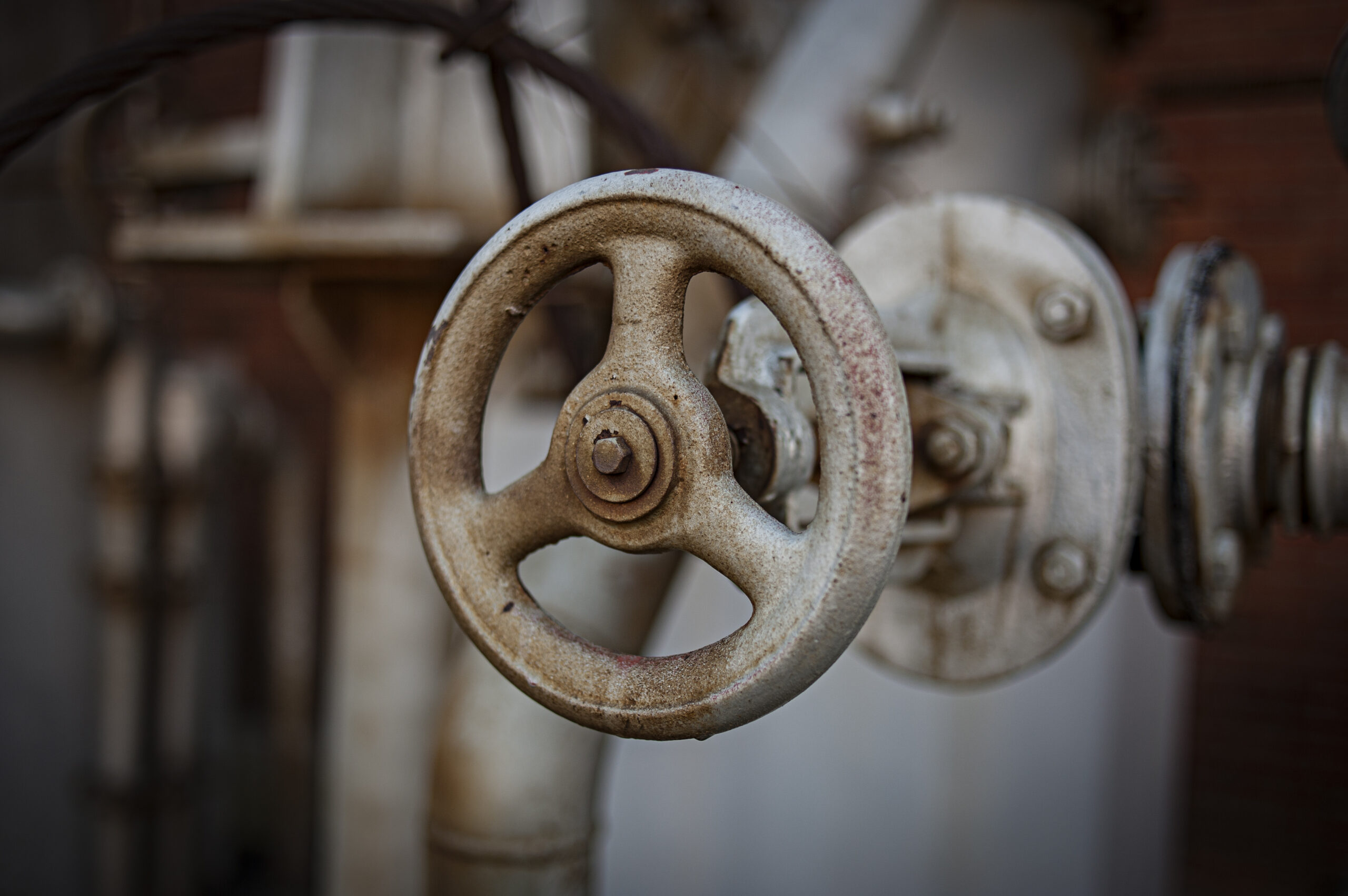 A closeup detail of an old metal wheel taken at the abandoned gasworks in Athens.