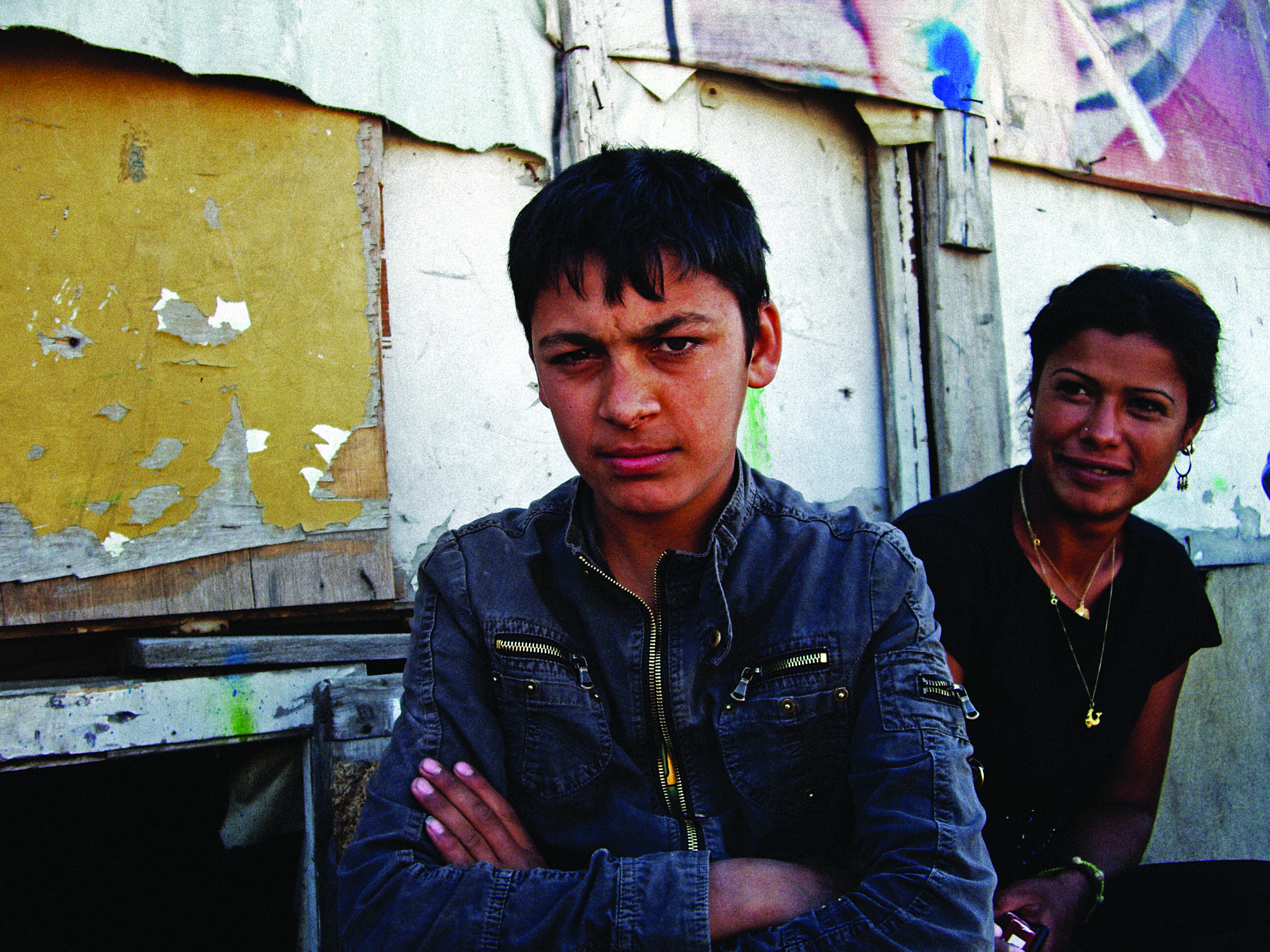 A young man and his proud mum at a Roma camp in Athens