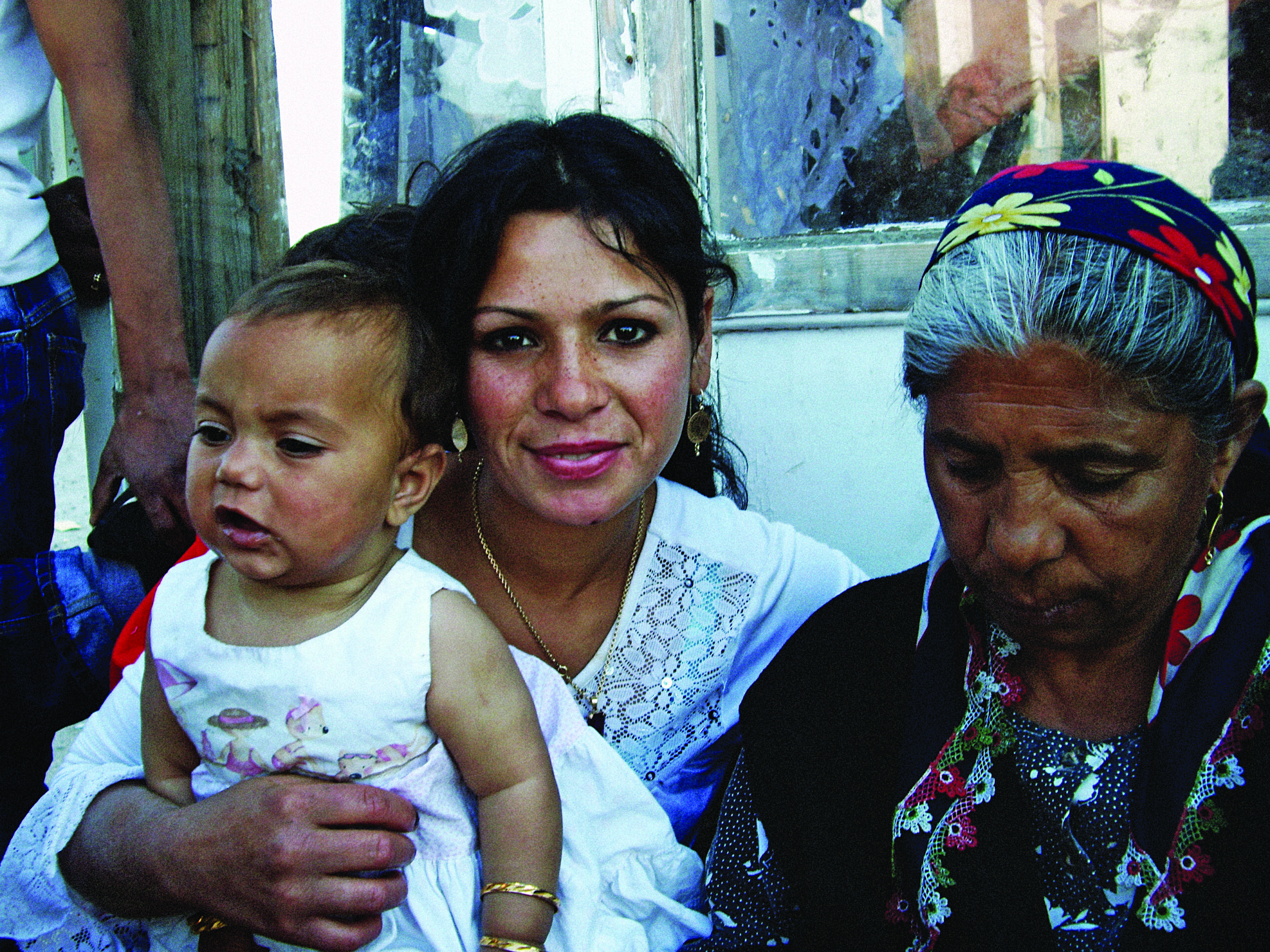 Family moment at a Roma camp in Athens.