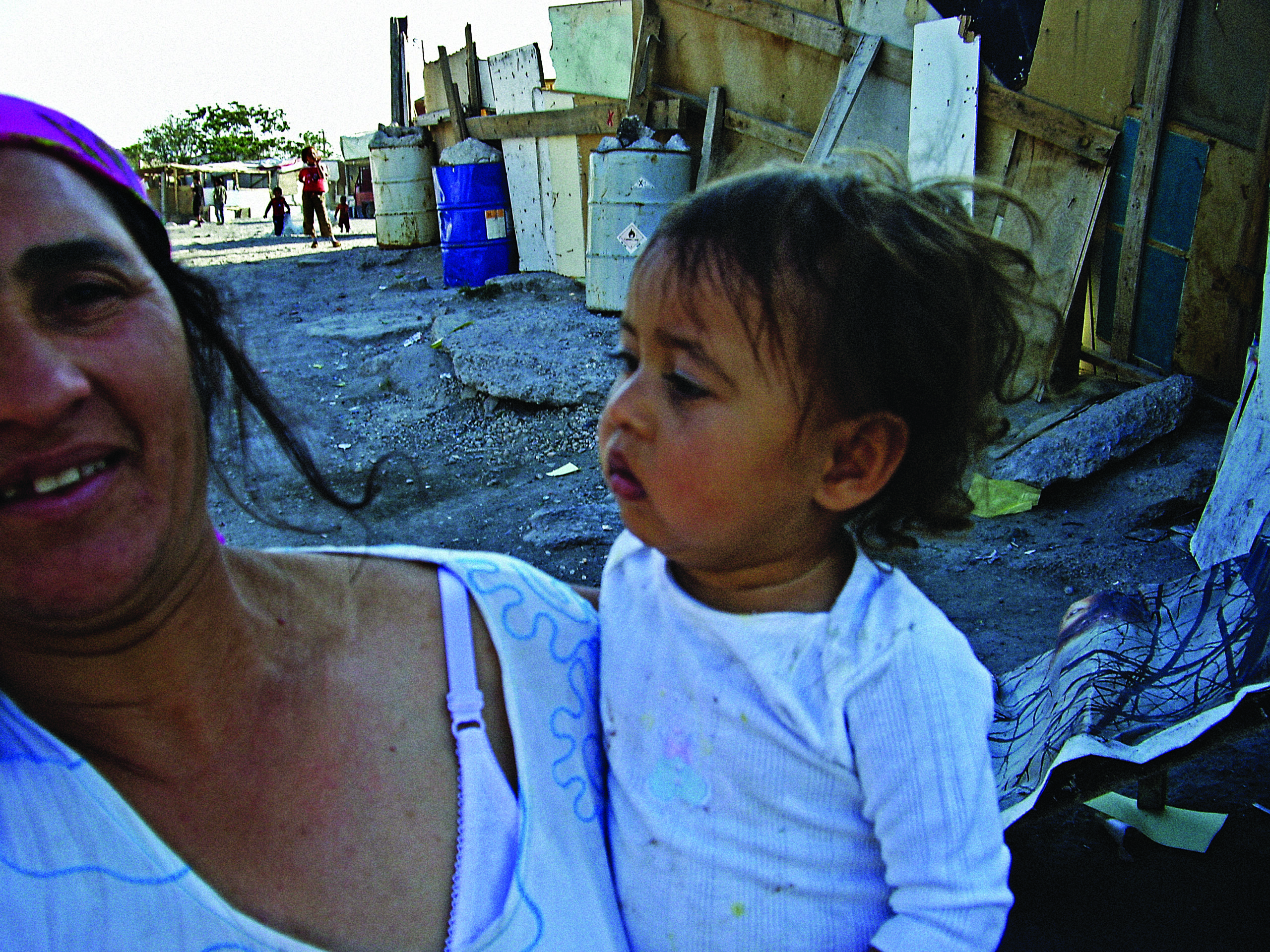Mum and baby at a Roma camp in Athens.