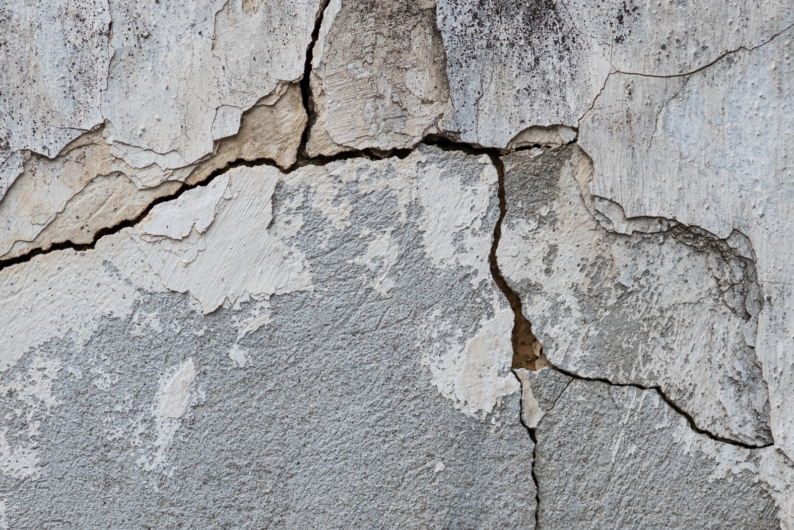 An extreme closeup of cracks on a wall.
